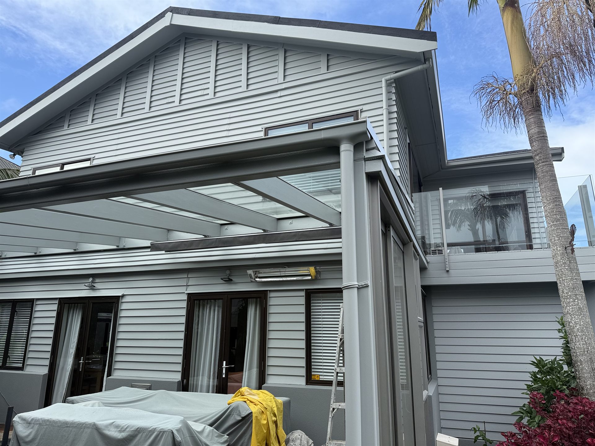 Rear elevation with repainted weatherboards, trims and pergola
