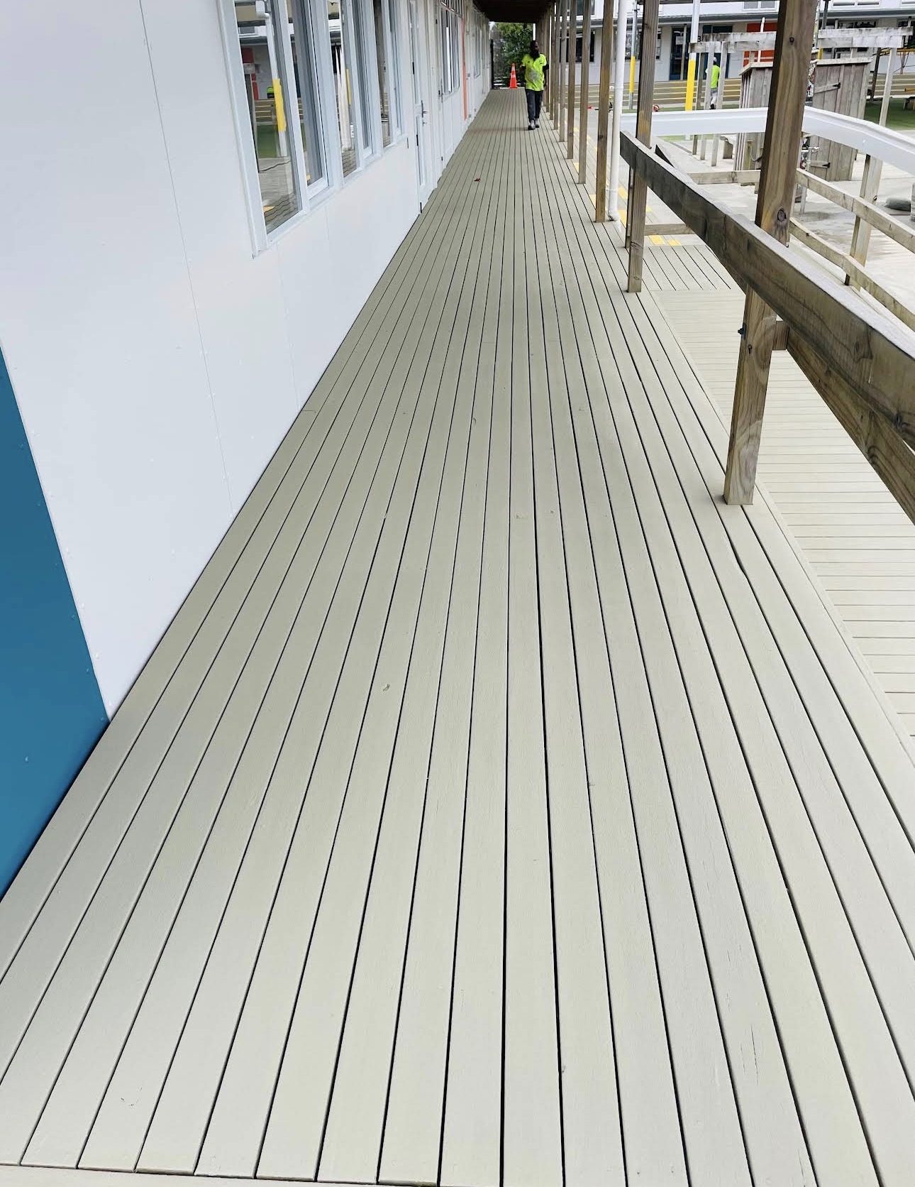 Freshly coated covered walkway running the length of a school classroom block
